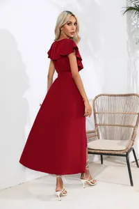 Back view of an elegant burgundy sleeveless dress with ruffle sleeves and long swing skirt