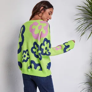 Back view detail of a cozy oversized lime green floral jacquard knit sweater for women