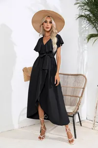 Detailed shot of ruffle V-neck sleeveless wrap dress in black with irregular hem