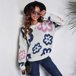 Detail view of women's loose floral jacquard knit sweater with drop shoulders.