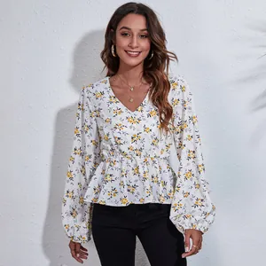 Detailed view of women's floral V-neck chiffon blouse with elegant lantern sleeves