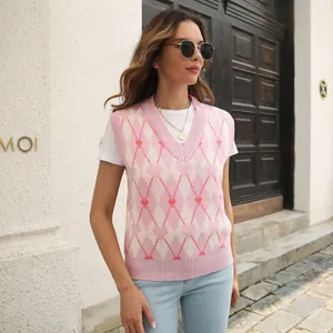 Stylish Y2K pink argyle knit vest with heart pattern worn by a model in outdoor setting.
