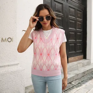 Detail view of a Y2K heart jacquard argyle knit vest with V-neckline in pink and white