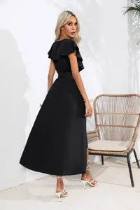 Back view of elegant black ruffle V-neck sleeveless maxi dress with a flowing skirt.