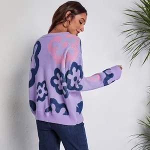 Back view of a comfortable loose purple knit sweater featuring pink floral jacquard patterns
