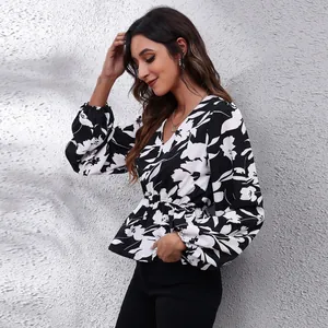 Elegant black and white floral V-neck chiffon blouse featuring stylish lantern sleeves