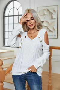 Elegant white button-embellished cold shoulder cable knit long sleeve pullover sweater on model