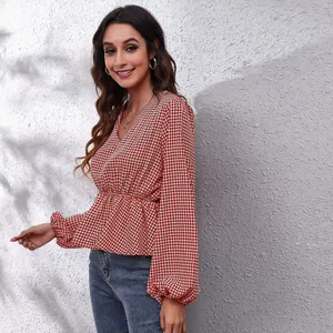 Elegant red and white houndstooth v-neck peplum blouse with stylish lantern sleeves.