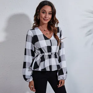 Elegant detail view of a V-neck buffalo plaid chiffon blouse with cinched waist