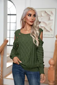 Close-up of olive green cable-knit sweater with cold-shoulder and button details