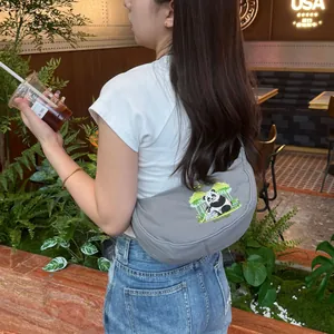Stylish grey crescent dumpling bag featuring cute panda embroidery for casual wear