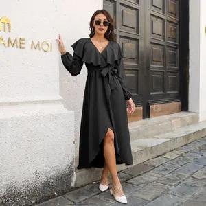 Elegant long black wrap dress with ruffled V-neck and asymmetrical split hem