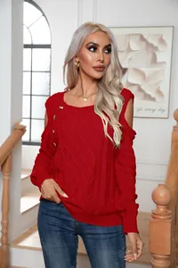 Close-up of red cold-shoulder cable-knit sweater with button detail and square neck