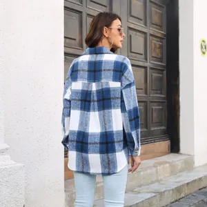 Back view of a blue and white plaid wool blend long sleeve shirt jacket for women.