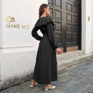 Elegant black long sleeve maxi dress with ruffle collar and side slit from back view