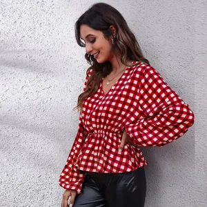 Detailed view of a red and white checkered V-neck chiffon blouse with lantern sleeves