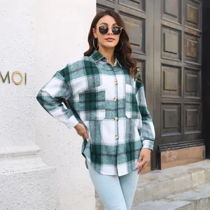 Outdoor shot of a green and white plaid long sleeve flannel shirt jacket for women.