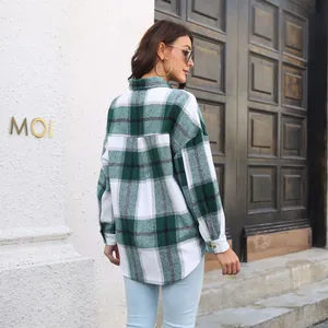 Rear view of a stylish green and white plaid wool-blend long sleeve shacket on a model