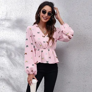 Elegant pink chiffon blouse featuring a butterfly print, V-neck, and long lantern sleeves