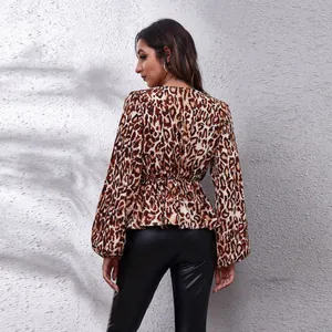Back view of a trendy leopard print chiffon blouse featuring elegant lantern sleeves