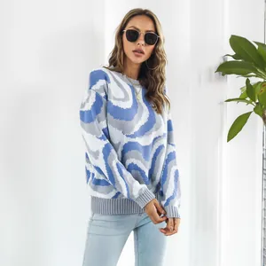 Close-up of stylish blue and grey jacquard tie-dye knit sweater on a female model