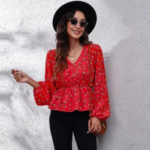 Elegant red floral V-neck chiffon blouse featuring lantern sleeves and a cinched waist design.