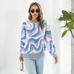 Detailed view of women's wave pattern oversized knit sweater in blue and grey