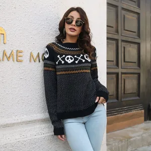 Woman wearing a retro Halloween skull knit sweater with polka dots and long sleeves.