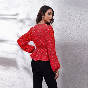 Back view of a red floral V-neck chiffon blouse with elegant lantern sleeves and waist tie