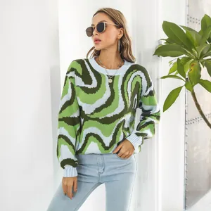 Detailed look at the green and blue wavy jacquard knit pattern on this women's sweater.