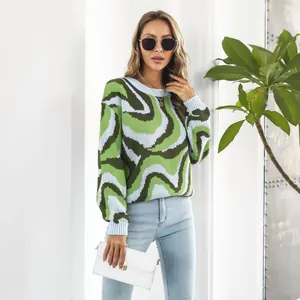 Detail view of a vibrant green swirl patterned jacquard sweater for a trendy casual look.