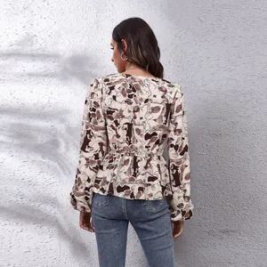 Back view of elegant floral print lantern sleeve chiffon blouse with waisted design details