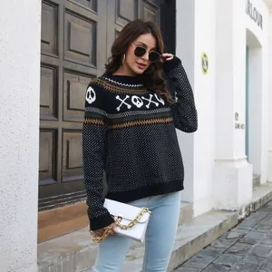 Full outdoor view of a black vintage polka dot sweater featuring XOXO skull patterns