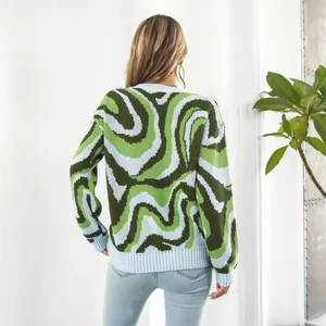 Back view of women's loose long-sleeved sweater with green wavy jacquard pattern