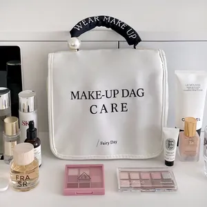Elegante weiße wasserdichte Kosmetiktasche mit Perlengriff für Reise und Make-up Aufbewahrung