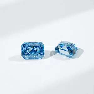 Macro detail of two radiant cut blue lab-grown diamonds with intense sparkle on white surface