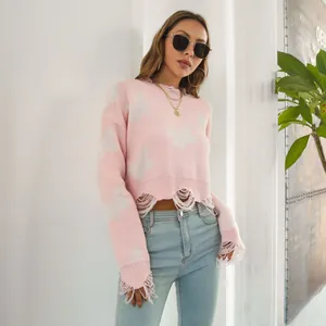 Detailed view of pink Y2K butterfly jacquard cropped sweater with distressed hem.