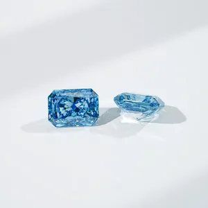 Macro view of two radiant cut blue lab-grown diamonds on a clean white background.