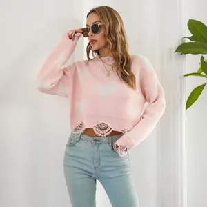 Stylish pink Y2K cropped sweater with white butterfly jacquard and distressed ripped edges