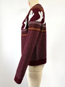Side view of burgundy Halloween knit sweater with ghost pattern and polka dots.