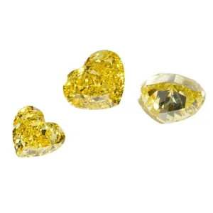 Three fancy vivid yellow heart-shaped lab-grown diamonds for wholesale and jewelry setting.