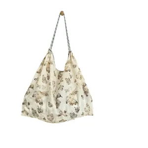 Spacious butterfly print canvas tote bag with comfortable rope handles for beach trips