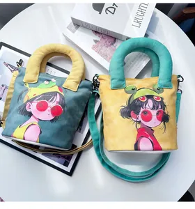 Detailed view of two cute hand-painted girl canvas bucket bags with frog hats and straps