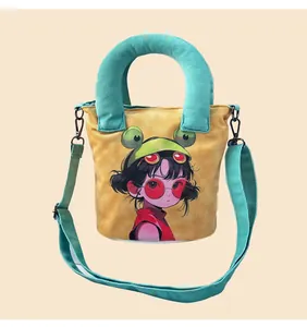 Detailed view of the hand-painted anime girl illustration on a cute canvas bucket bag.