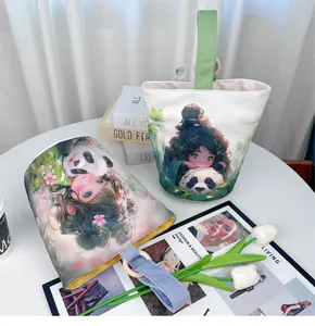 Close-up detail of the charming girl and panda illustration on a high-quality canvas bucket bag