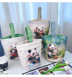 Detailed group view of canvas bucket bags featuring cute panda character illustrations
