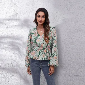Stylish floral print women's V-neck top with a gathered waist and lantern sleeves