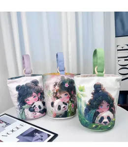 Close-up view of three canvas bucket handbags featuring cute anime girl and panda prints