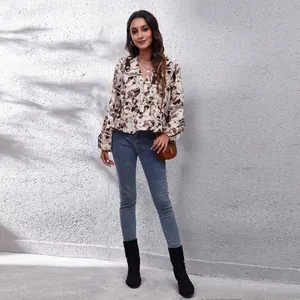 Elegant abstract floral print peplum blouse with V-neck and lantern sleeves for women