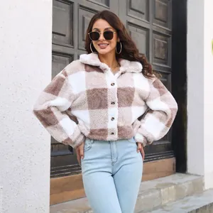 Detailed view of women's plaid sherpa jacket with lantern sleeves and button front